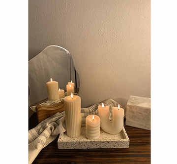 candles 3 McNab’s fondness for candles leads to Bare Essentials