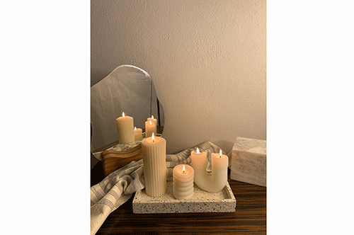 candles 3 McNab’s fondness for candles leads to Bare Essentials