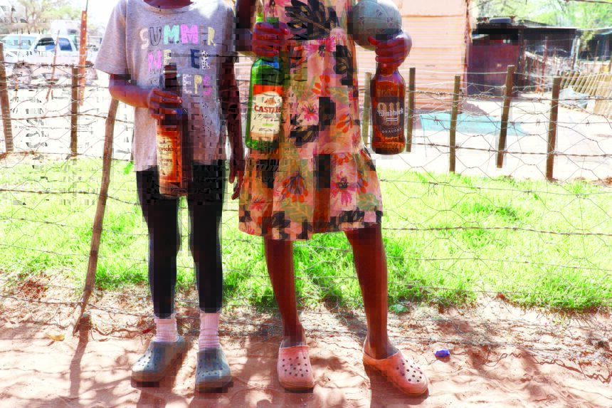 Dordabis Minors sell bottles for survival